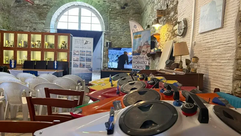 Student vessel hulls staged in rows at the Syros Nautical Club