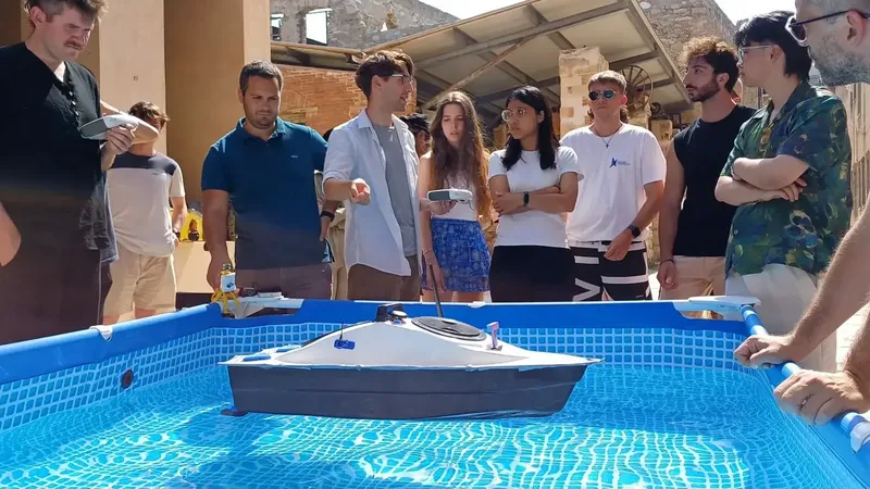 Students around the test pool watching an autonomous vessel